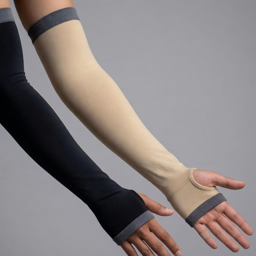 Black and beige arm sleeves on arms against a gray background